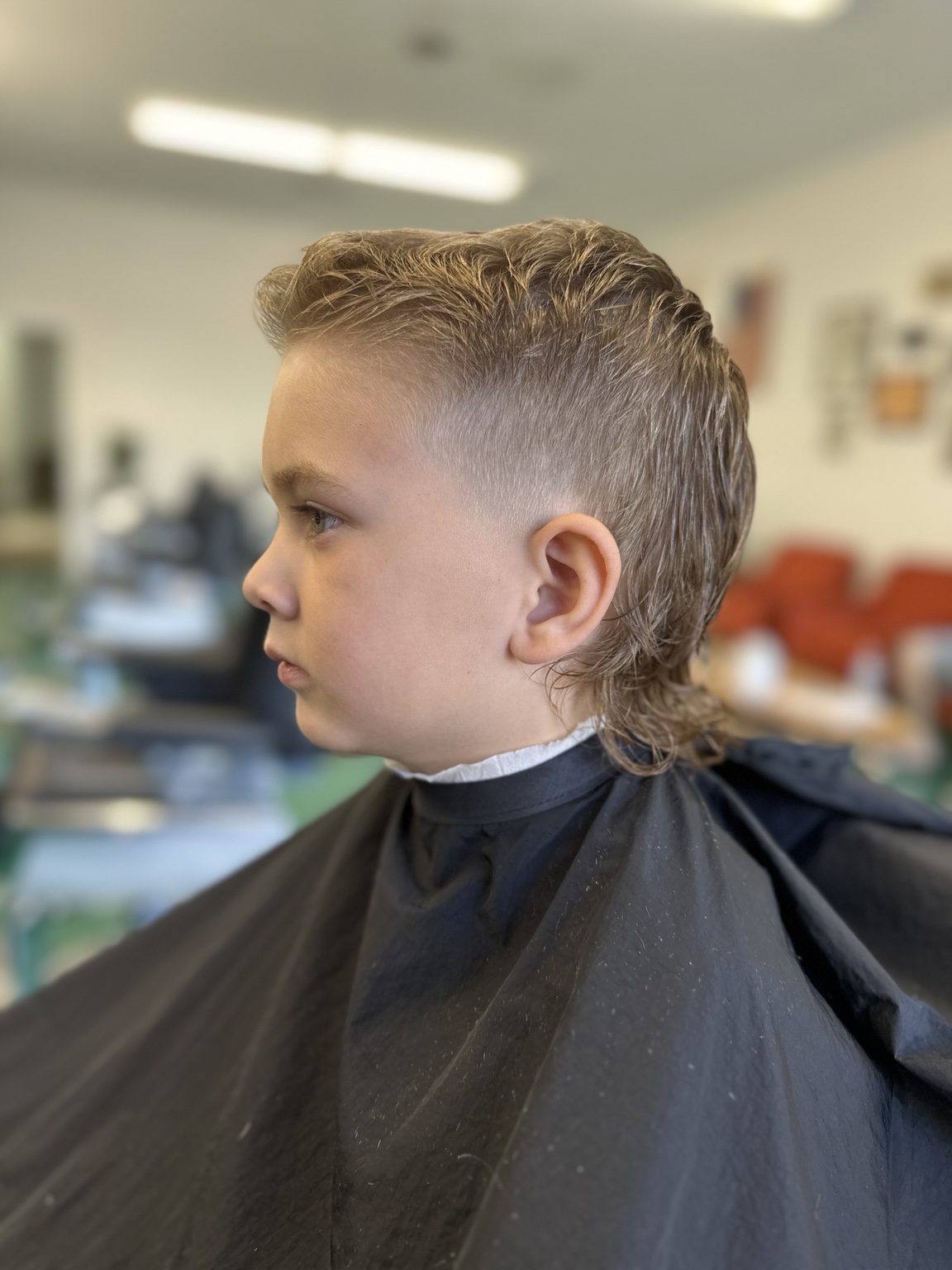 Curly mullet haircut by Kandice Maxine