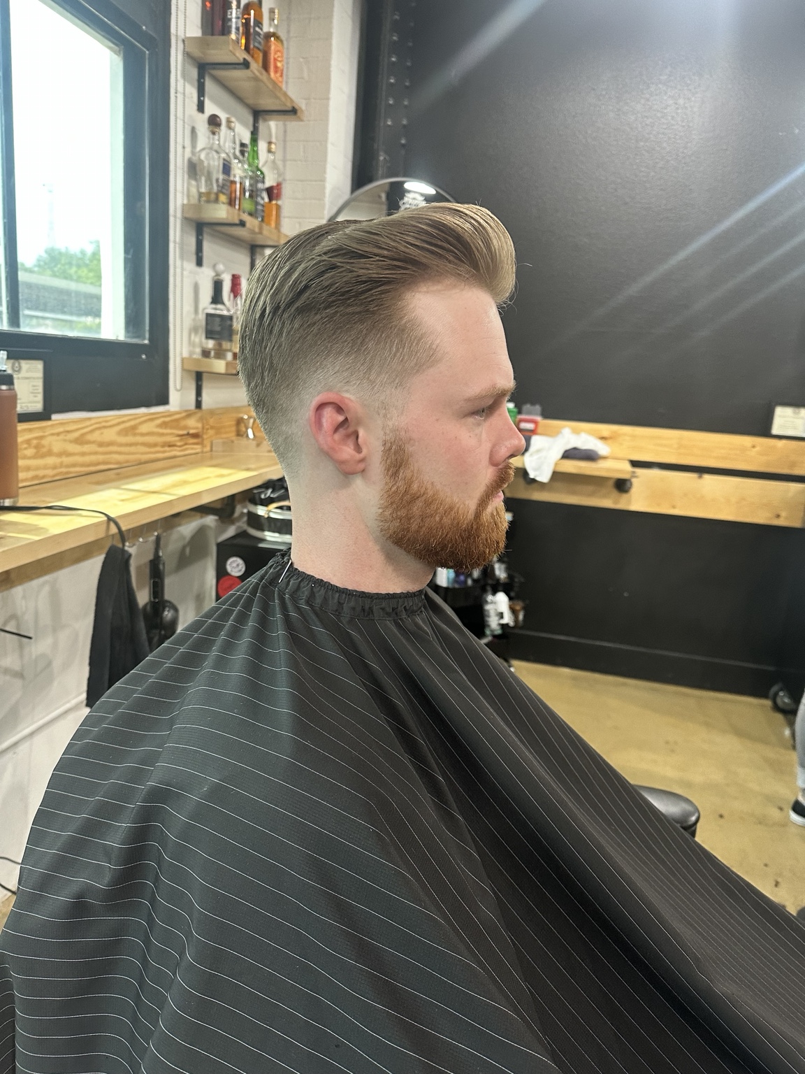 Slick back + beard haircut by Kandice Maxine