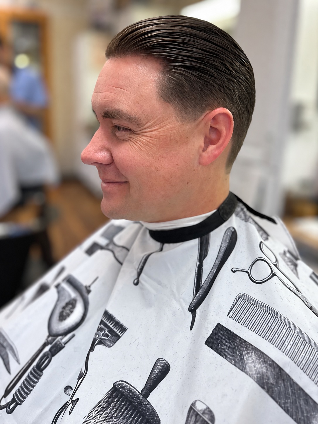 Classic slick back haircut by Kandice Maxine