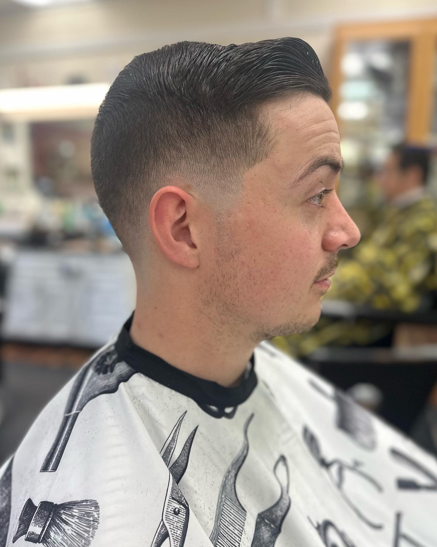 Sharp fade haircut by Kandice Maxine